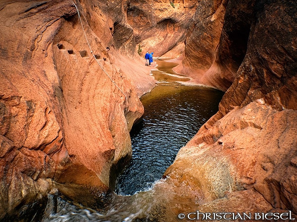 Natural pools and hikers, Water Canyon, Red Cliffs Recreation Area, Utah