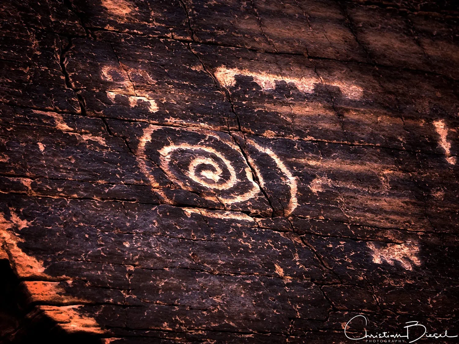 A spiral and other petroglyphs. Mud Wash, Gold Butte National Monument A spiral and other petroglyphs. Mud Wash, Gold Butte National Monument